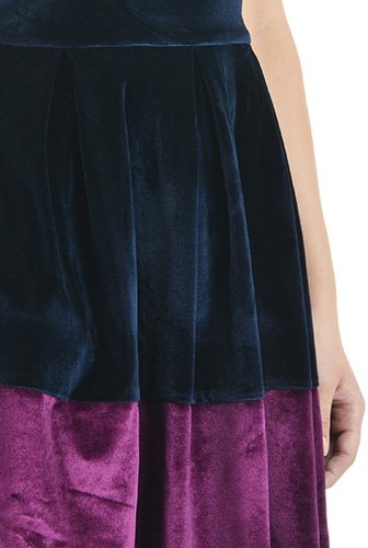 Color blocking adds sophisticated appeal to our velvet dress in a classically feminine silhouette. Box-pleats radiate from the wide banded waist to add soft fullness to the style.