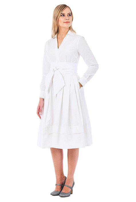 Our cotton poplin shirtdress with a surplice V-neck is cinched with a wide obi sash belt and tailored with inverted pleats for a full skirt. 