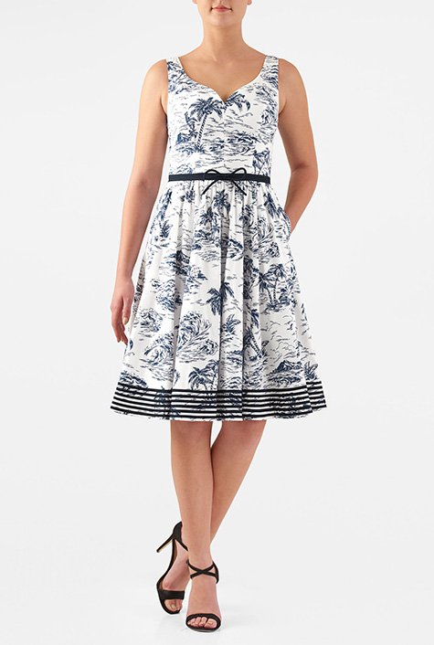 Our graphic island print dress is styled with a low dipping sweetheart bodice to add just the right topping for the bow-tied fit-and-flare silhouette.