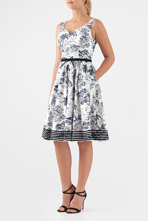 Our graphic island print dress is styled with a low dipping sweetheart bodice to add just the right topping for the bow-tied fit-and-flare silhouette.