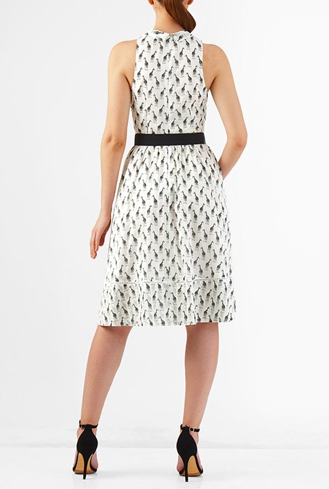 Our giraffe print cotton dress styled with a trend right neck-tie to top the ultrafemme style, is cinched in with a removable poplin belt and finished with lattice trim at the hem.