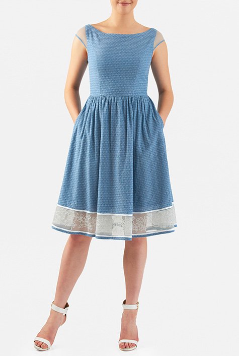 Our fit-and-flare dress is cut from woven cotton chambray dobby with sheer tulle inserts at the set-in cap sleeves and floral embellished hem with piped trim.