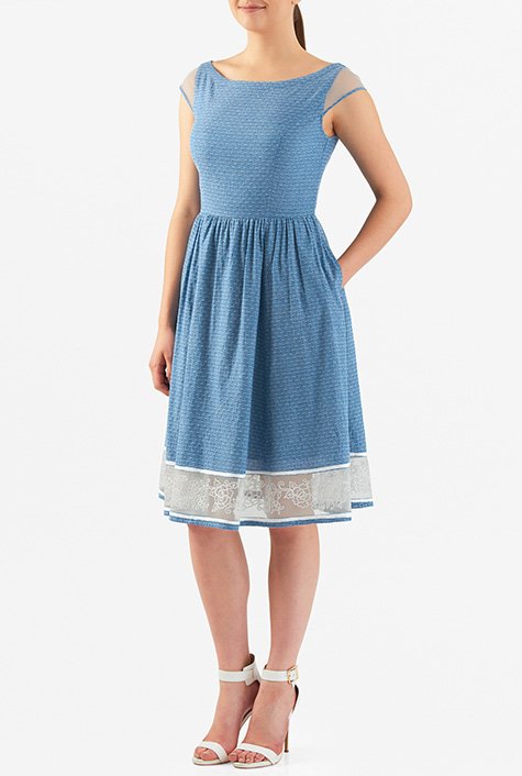 Our fit-and-flare dress is cut from woven cotton chambray dobby with sheer tulle inserts at the set-in cap sleeves and floral embellished hem with piped trim.