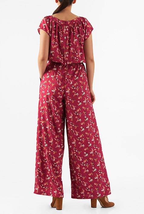 Our floral print crepe jumpsuit in a blousony silhouette is fashioned with a flirty front cutout and finished with breezy hems.