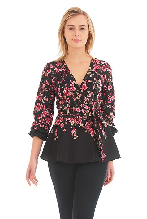 Our wrap top with a universally flattering fit is made all the more appealing with floral print placement and a breezy flared peplum.
