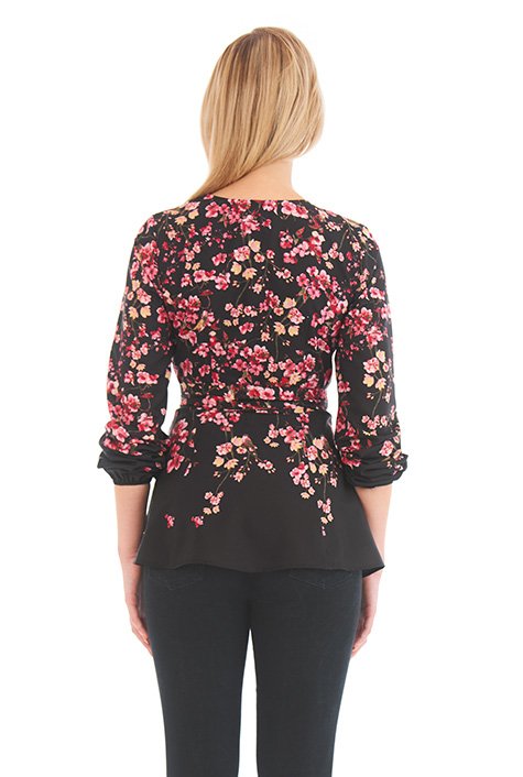 Our wrap top with a universally flattering fit is made all the more appealing with floral print placement and a breezy flared peplum.