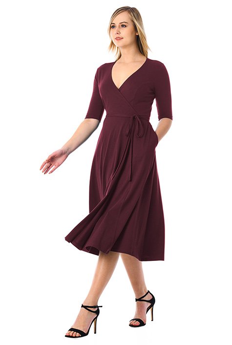 Floaty wrap styling highlights our cotton knit dress cinched in at the seamed waist with attached half-ties.