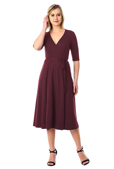 Floaty wrap styling highlights our cotton knit dress cinched in at the seamed waist with attached half-ties.
