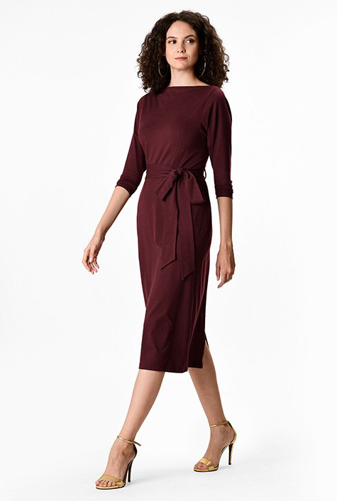 Demure sleeves and a high neckline add to the timeless elegance of our versatile sheath that can be easily dressed up or down to fit the occasion. 