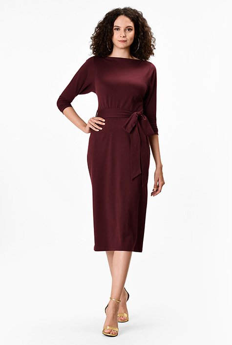 Demure sleeves and a high neckline add to the timeless elegance of our versatile sheath that can be easily dressed up or down to fit the occasion. 