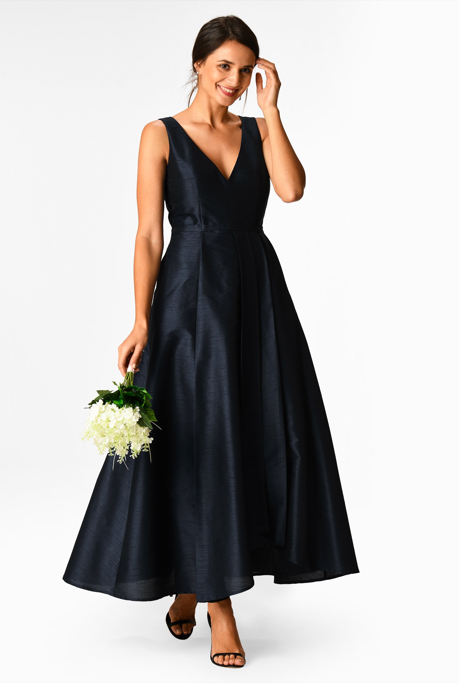 An elegant wide V-neck tops our polydupioni dress in a trend-right hue and a wide pleated ballgown-volume faux-wrap skirt.