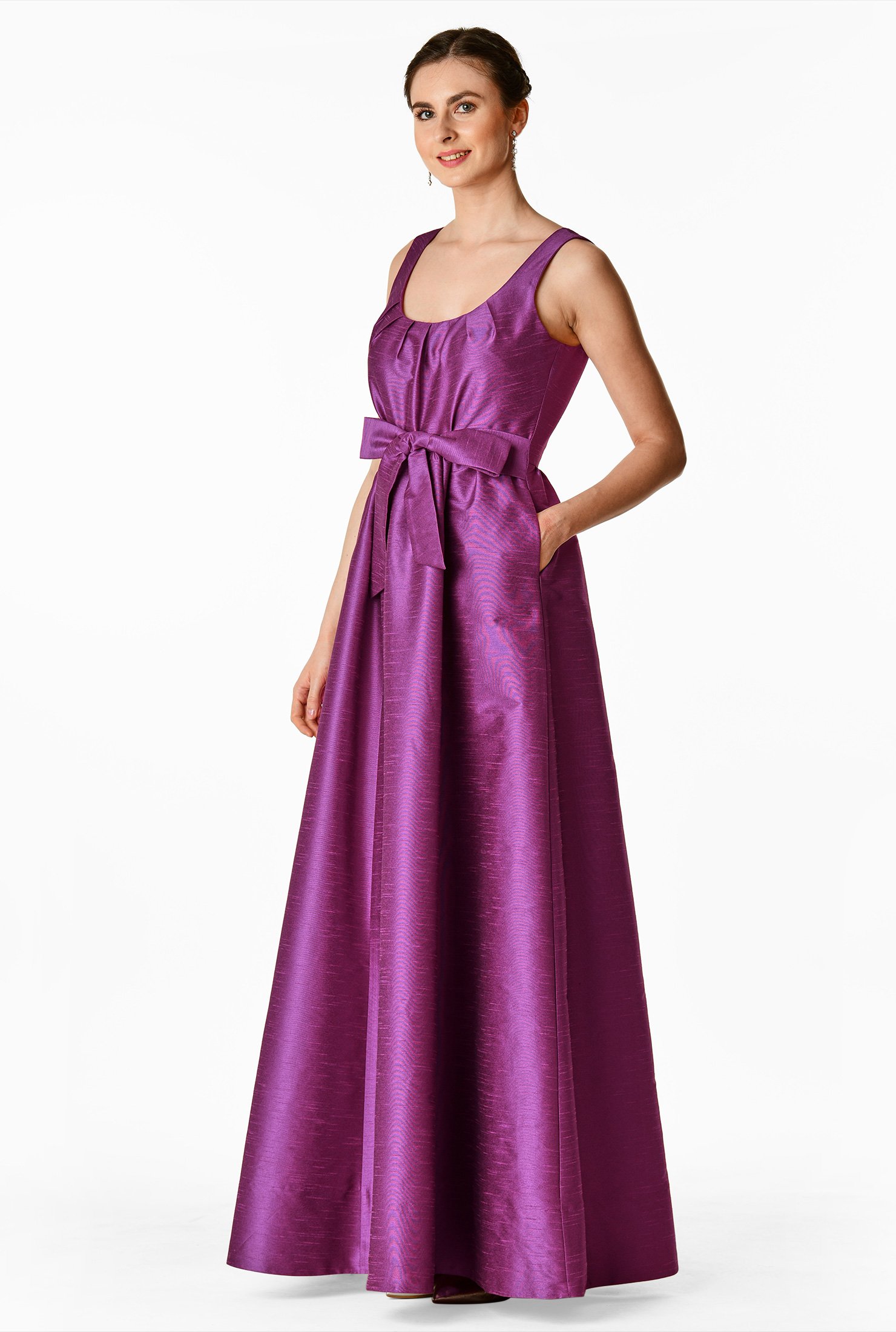 A bow-tie front lends feminine appeal to our polydupioni dress, cinched in with  attached sash-ties at the seamed waist above the ruched pleat full skirt.