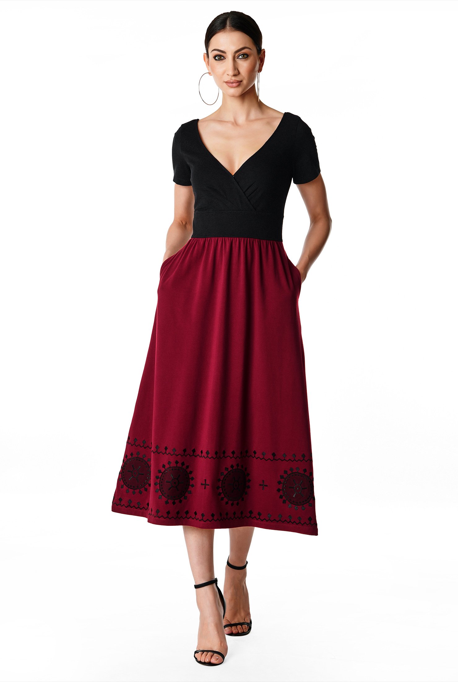 Graphic embroidery at the hem textures our cotton jersey color block dress designed with effortlessly flattering surplice styling and a midi-length skirt.