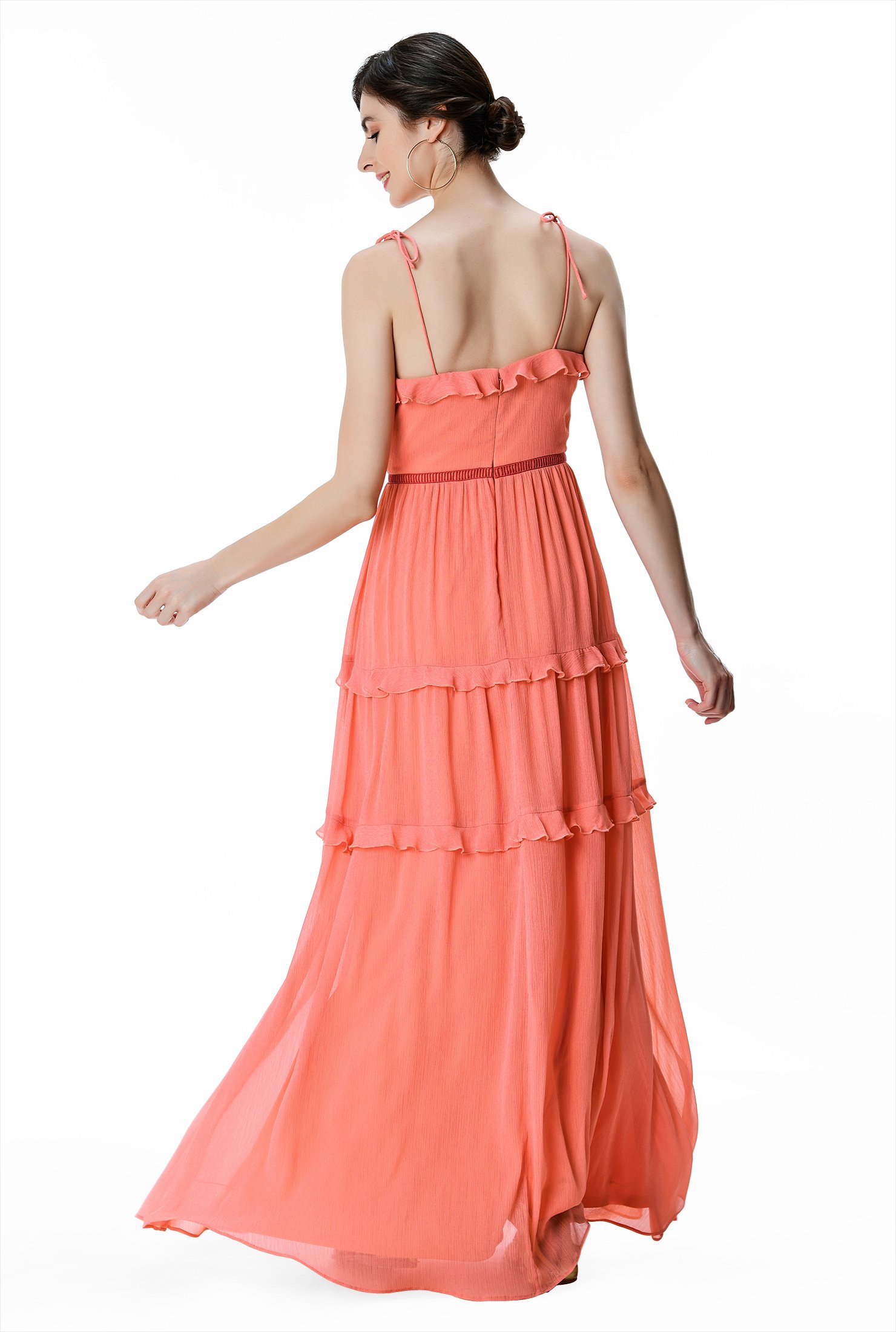 A delight for the eye, our romantic chiffon maxi dress is trimmed with frilly ruffles at the neckline and flouncy tiers and cinched in at the seamed waist with lattice trim.
