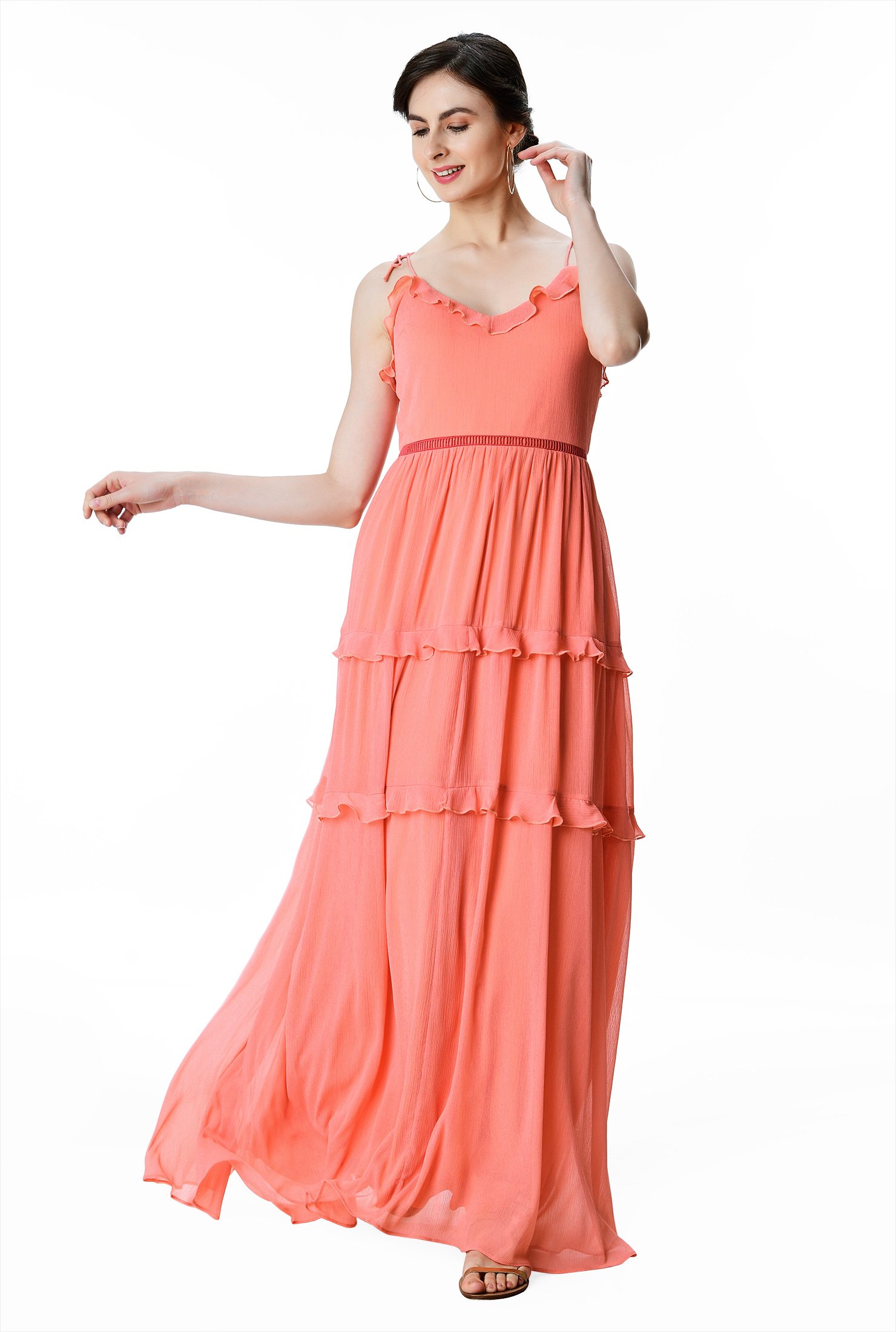 A delight for the eye, our romantic chiffon maxi dress is trimmed with frilly ruffles at the neckline and flouncy tiers and cinched in at the seamed waist with lattice trim.