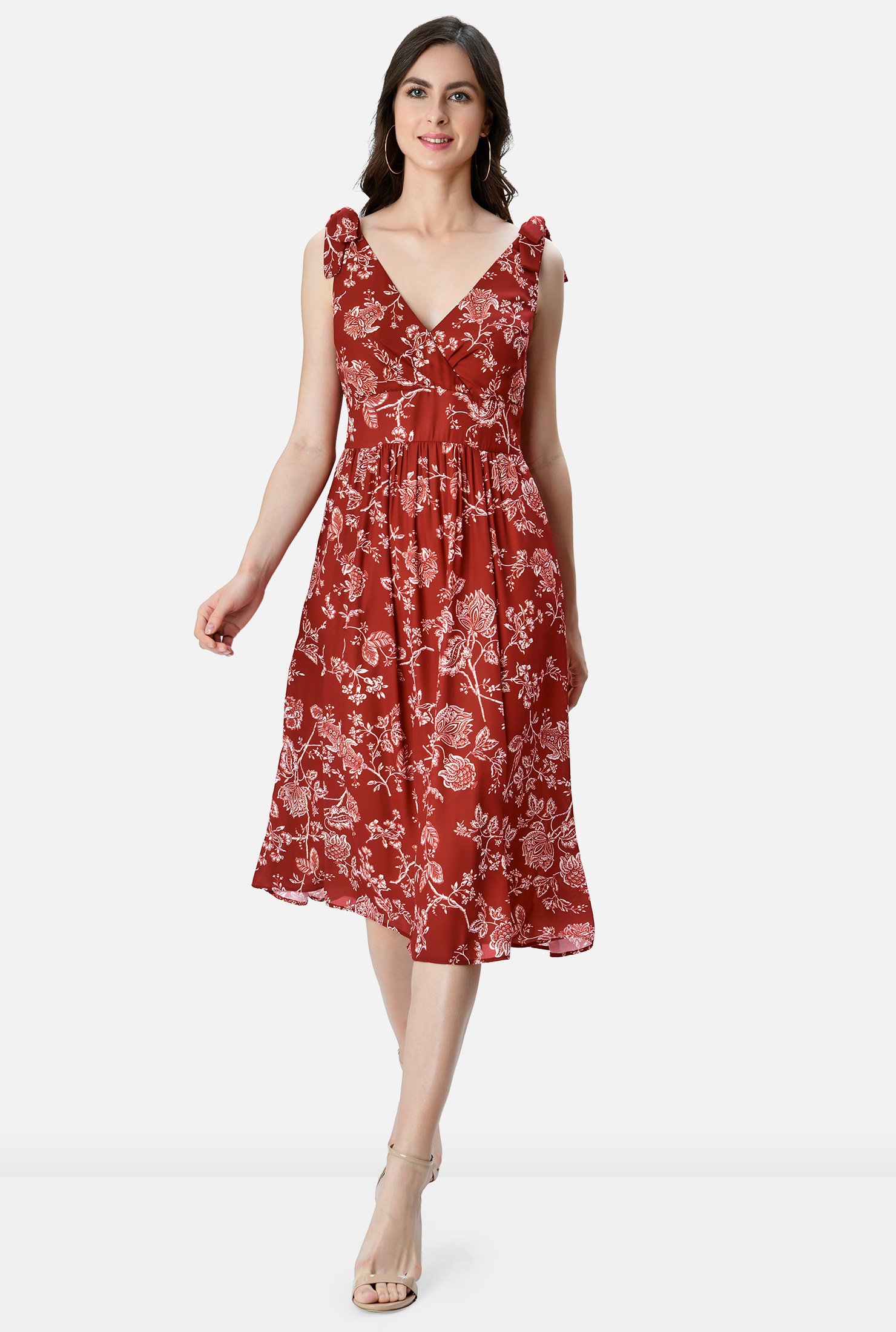 Our floral print crepe dress is designed to flatter and enhance with an angled pleat surplice bodice, banded empire waist and ruched pleat full skirt.