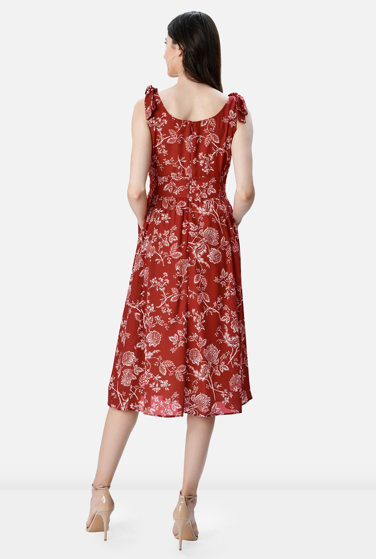 Our floral print crepe dress is designed to flatter and enhance with an angled pleat surplice bodice, banded empire waist and ruched pleat full skirt.