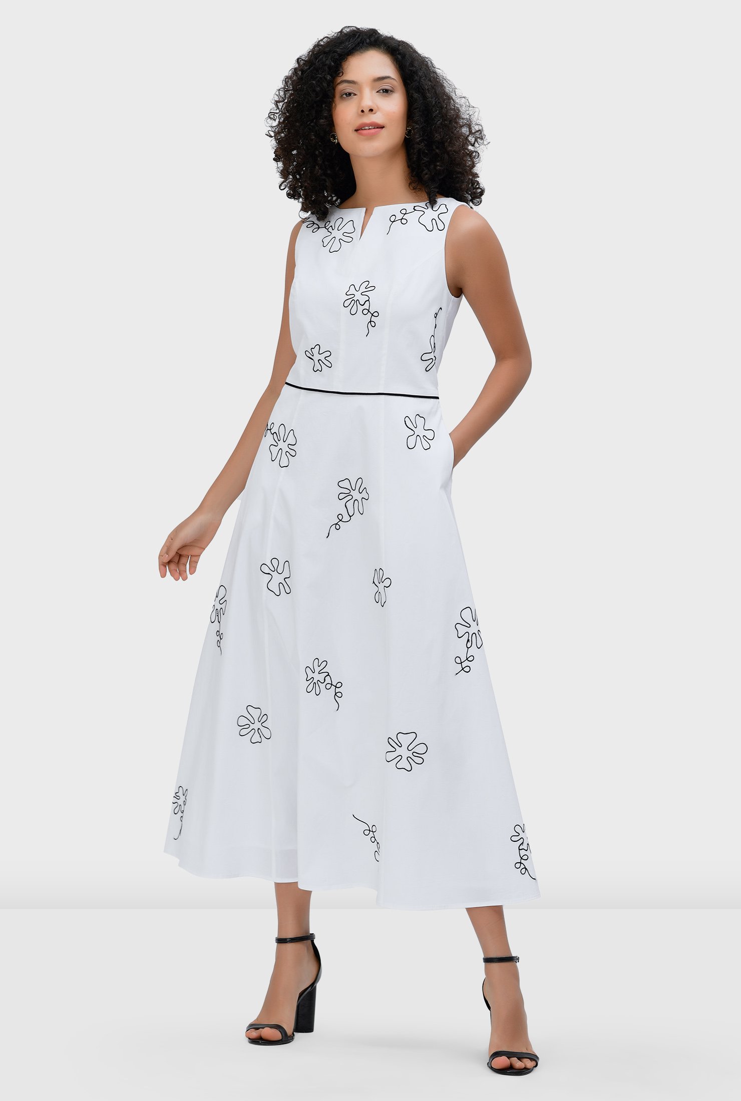 Graphic floral embroidery amps up the seventies charm of our cotton poplin dress, cut in a flattering A-line silhouette and cinched in at the contrast seamed waist atop a full flare skirt.