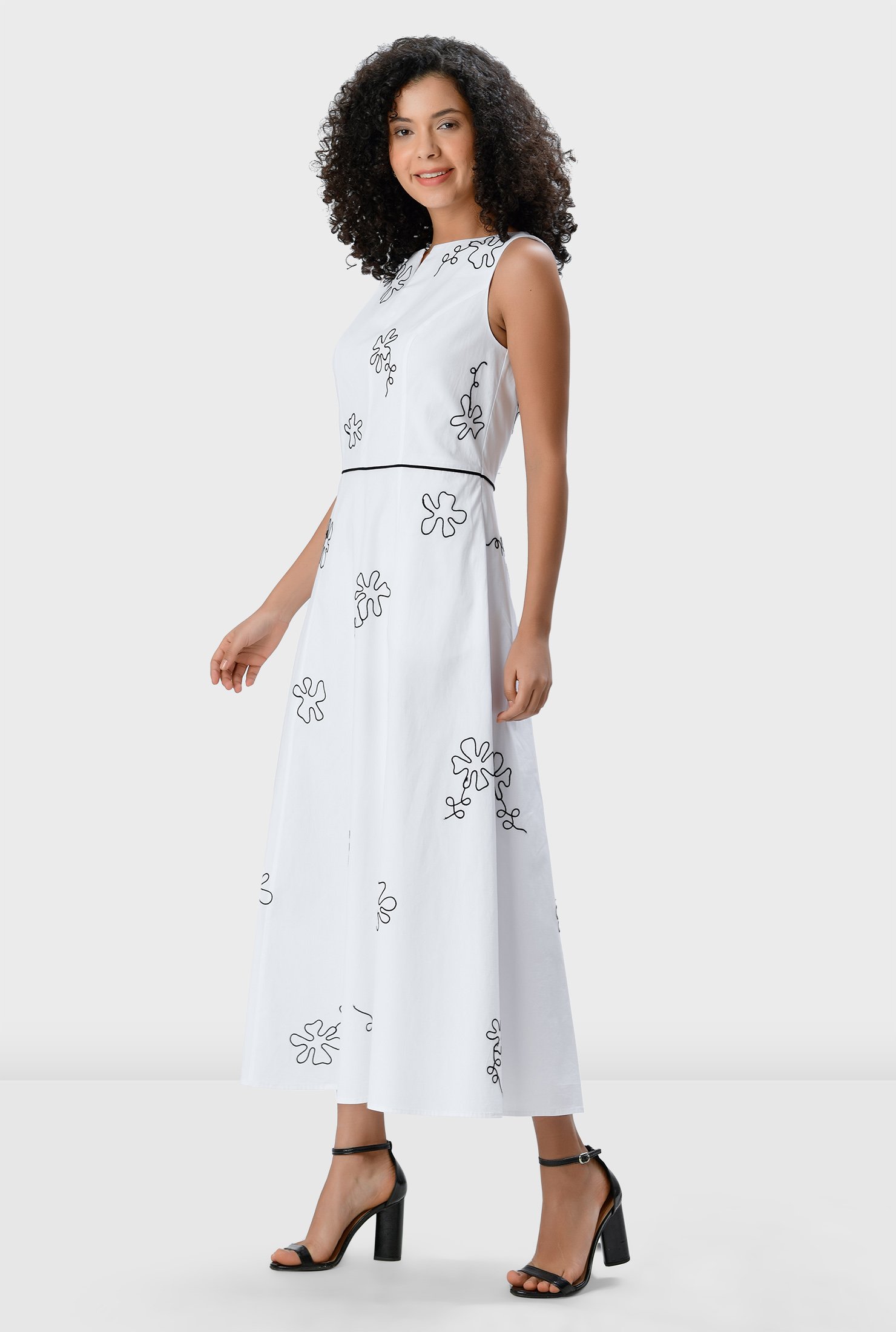 Graphic floral embroidery amps up the seventies charm of our cotton poplin dress, cut in a flattering A-line silhouette and cinched in at the contrast seamed waist atop a full flare skirt.