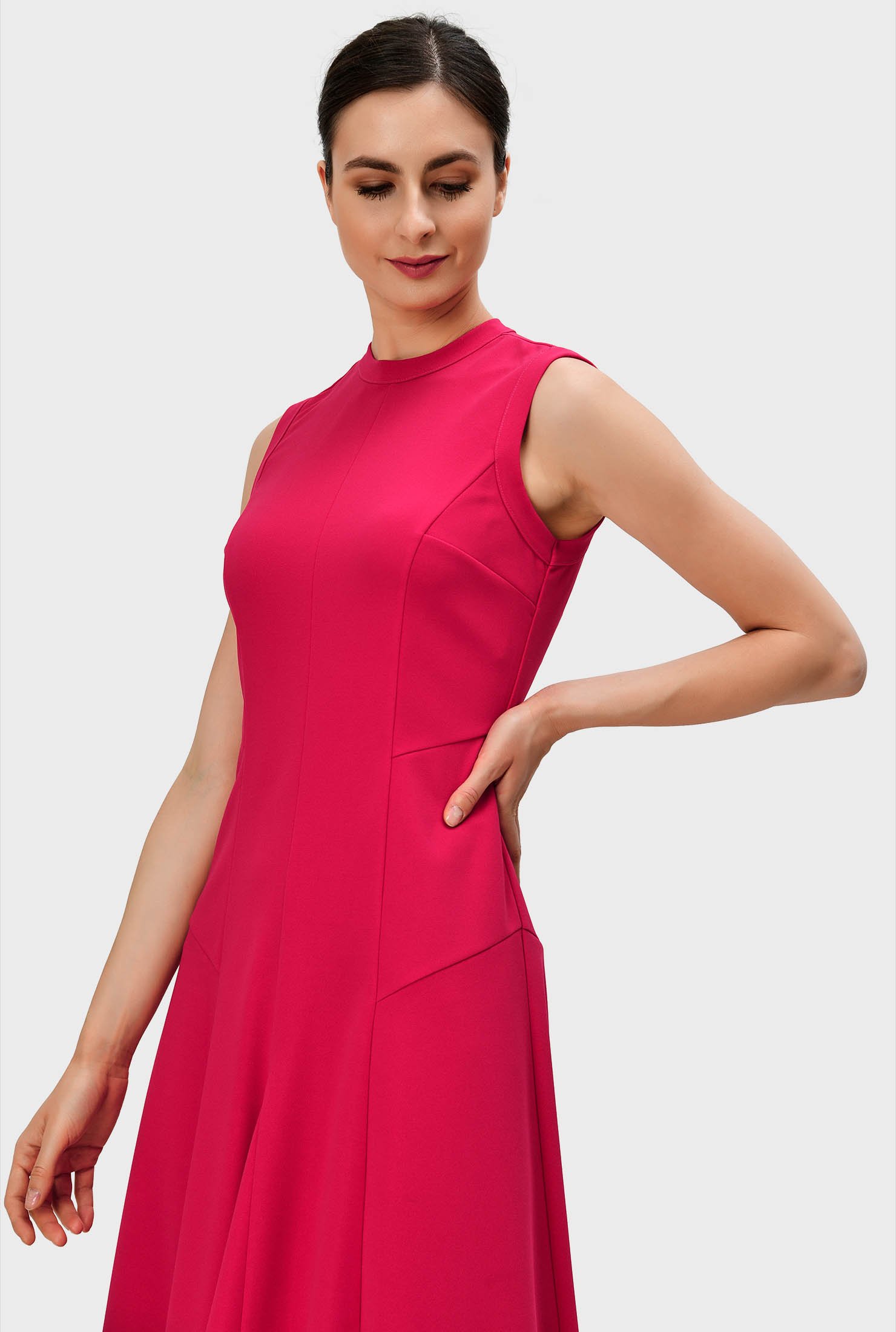 Polished yet relaxed in elegantly fluid jersey, our shaped crepe knit dress in flattering seamed and segmented panels is cinched in at the side with an asymmetric seamed waist.