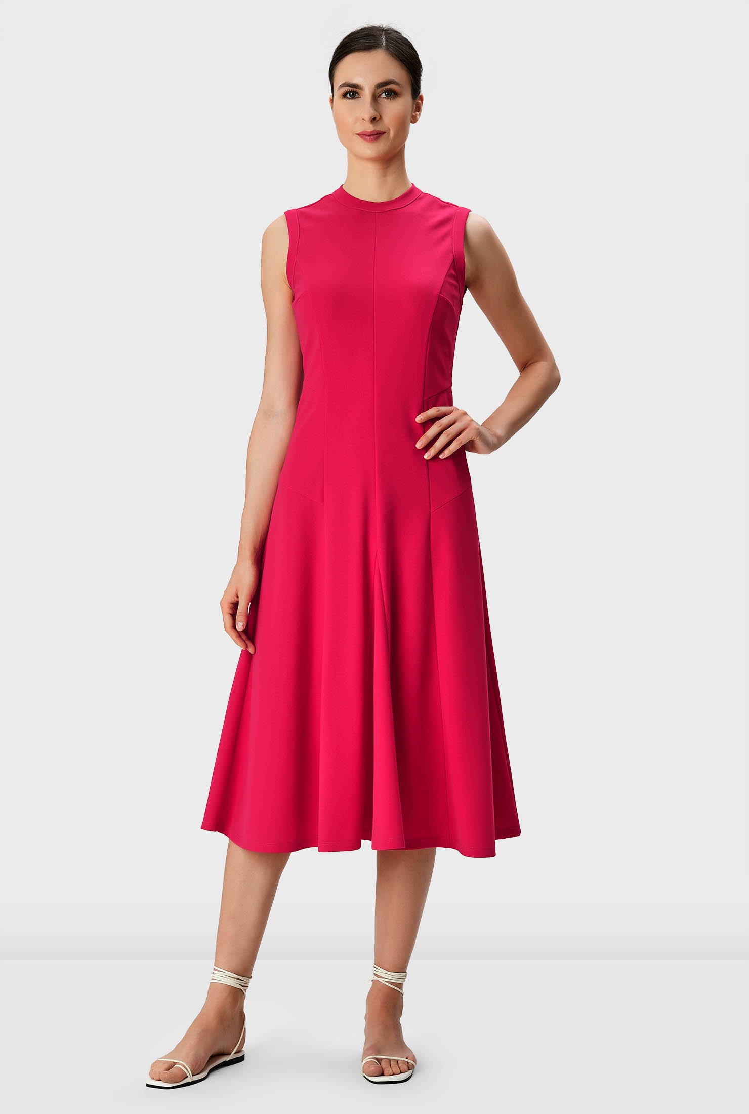 Polished yet relaxed in elegantly fluid jersey, our shaped crepe knit dress in flattering seamed and segmented panels is cinched in at the side with an asymmetric seamed waist.