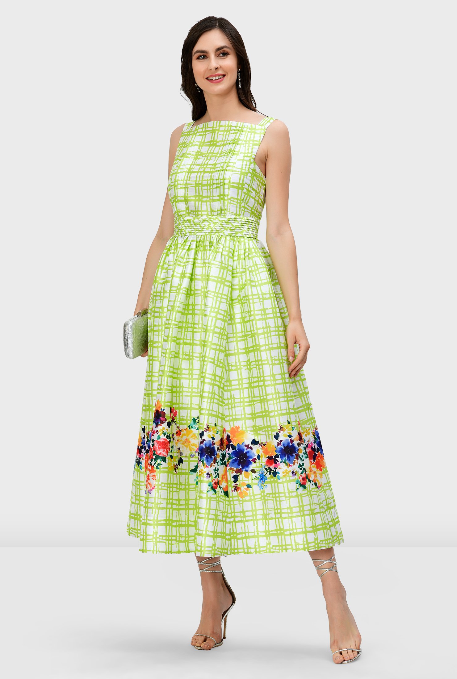 Watercolor florals pop up in vibrant hues on our check print polydupioni dress styled with a fitted bodice and full flared skirt while a trapunto banded waist cinches in the flattering silhouette.