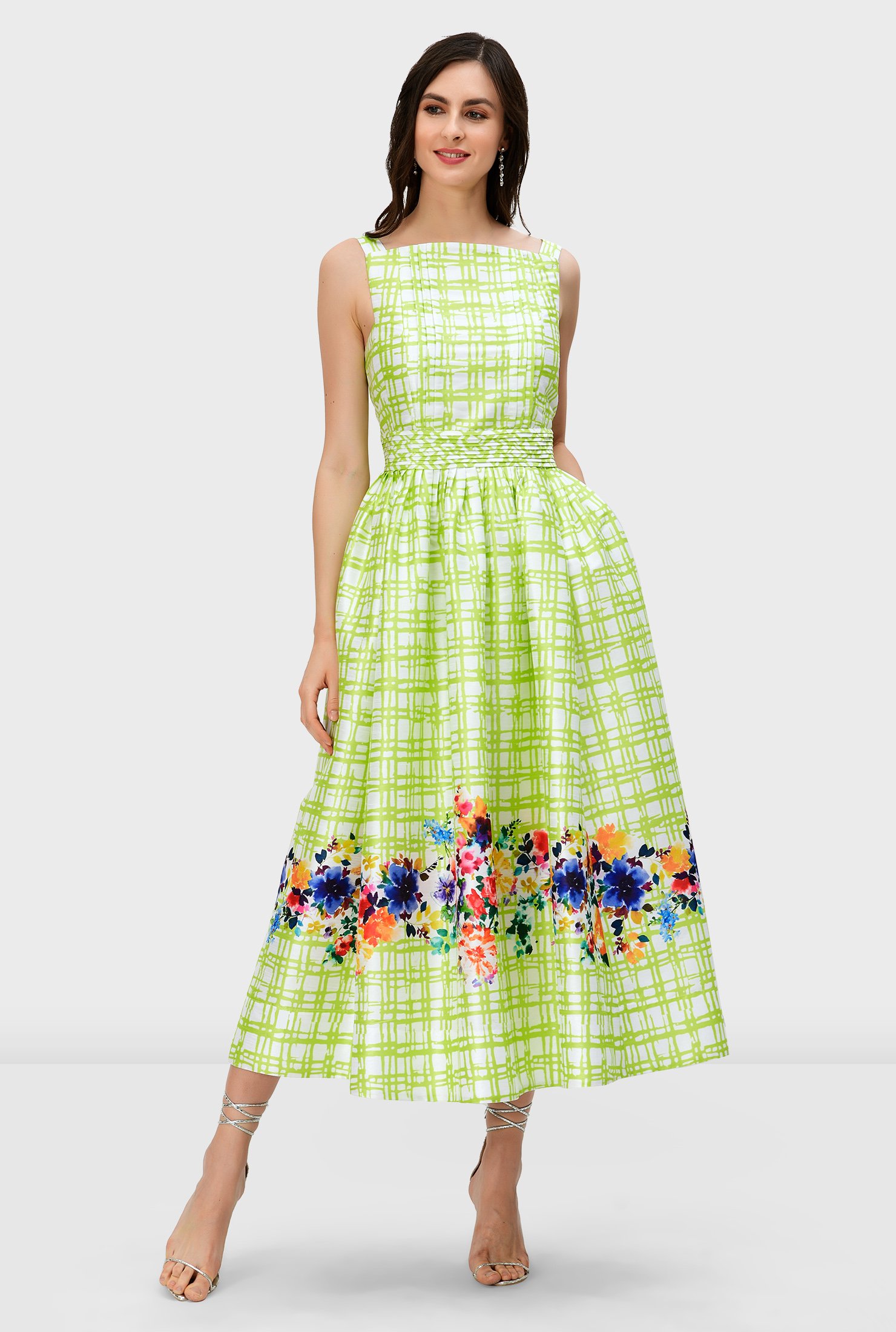Watercolor florals pop up in vibrant hues on our check print polydupioni dress styled with a fitted bodice and full flared skirt while a trapunto banded waist cinches in the flattering silhouette.