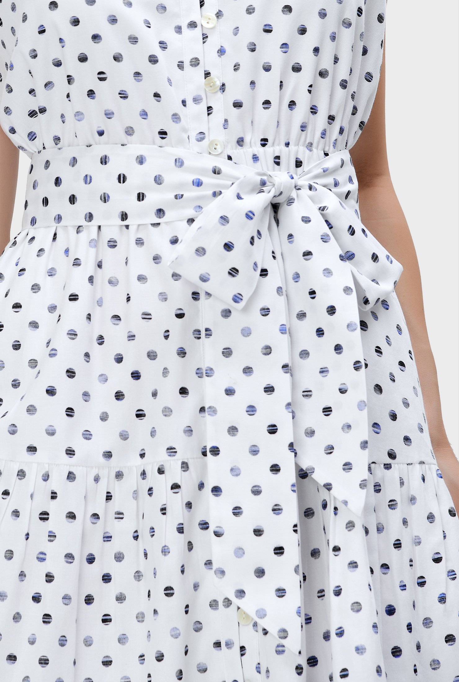 Fresh as the season itself, our happy polka dot print cotton elevates the everyday with eye-catching details like embellished scallops at the swingy hem.