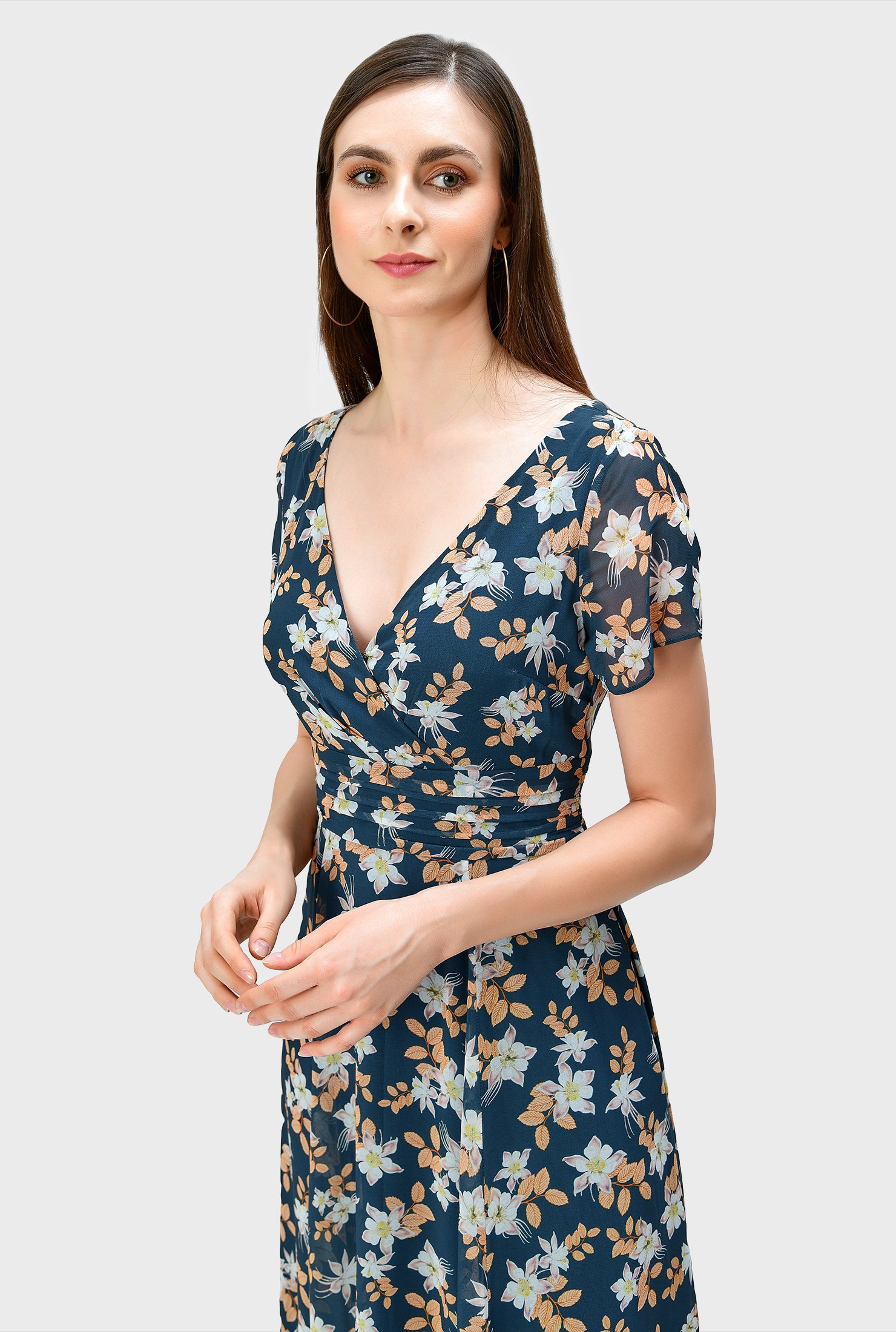 Our floral print georgette dress with lattice trim at the floaty handkerchief hem is designed with effortlessly flattering surplice styling and a full flare skirt.