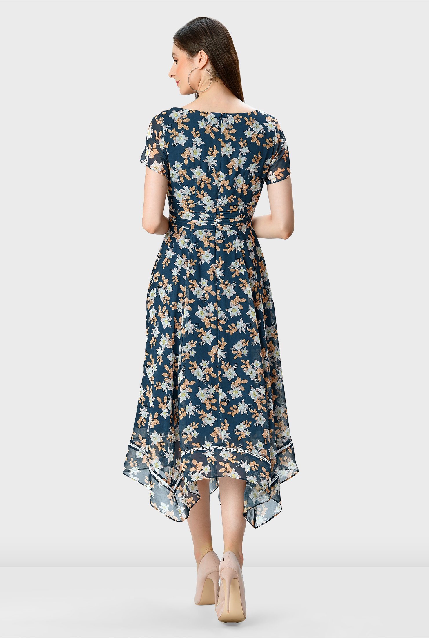 Our floral print georgette dress with lattice trim at the floaty handkerchief hem is designed with effortlessly flattering surplice styling and a full flare skirt.