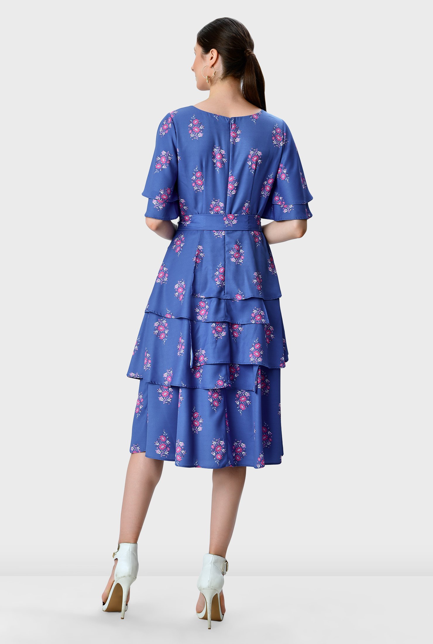 A summer stunner! Fluttering ruffles cascade down the sleeves and asymmetric tier skirt of our floral print crepe fit-and-flare dress that will bring feminine charm and a bit of romance to your upcoming events.