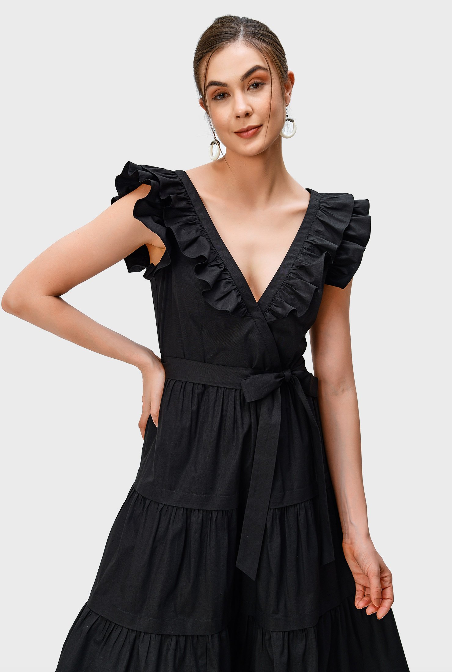Ruched tiers form the flirty skirt of our cotton poplin dress that's textured with ruffles at the neckline and sleeves.