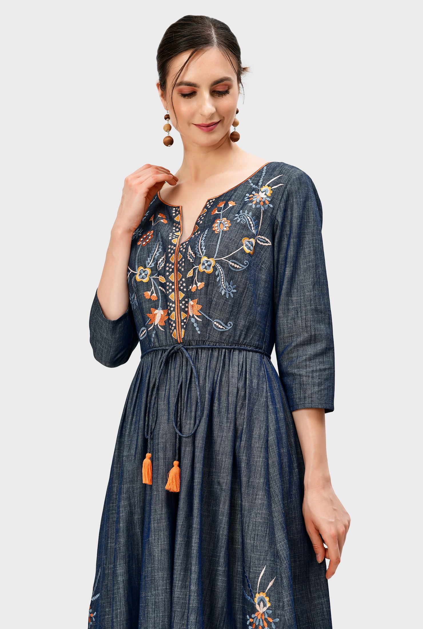 Perfect your work-from-anywhere style with our versatile cotton chambray dress with floral vine embroidery that strikes a balance between ease and elegance. 
