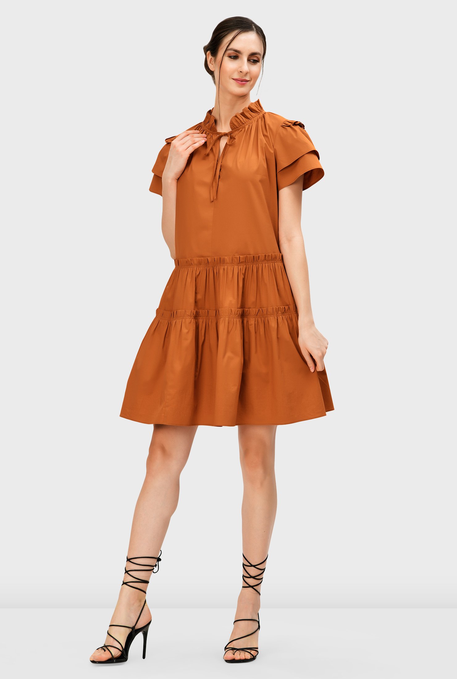 Our crisp cotton poplin dress offers pretty ruffle frills and a tiered skirt for a look that's well-matched to summery fun.