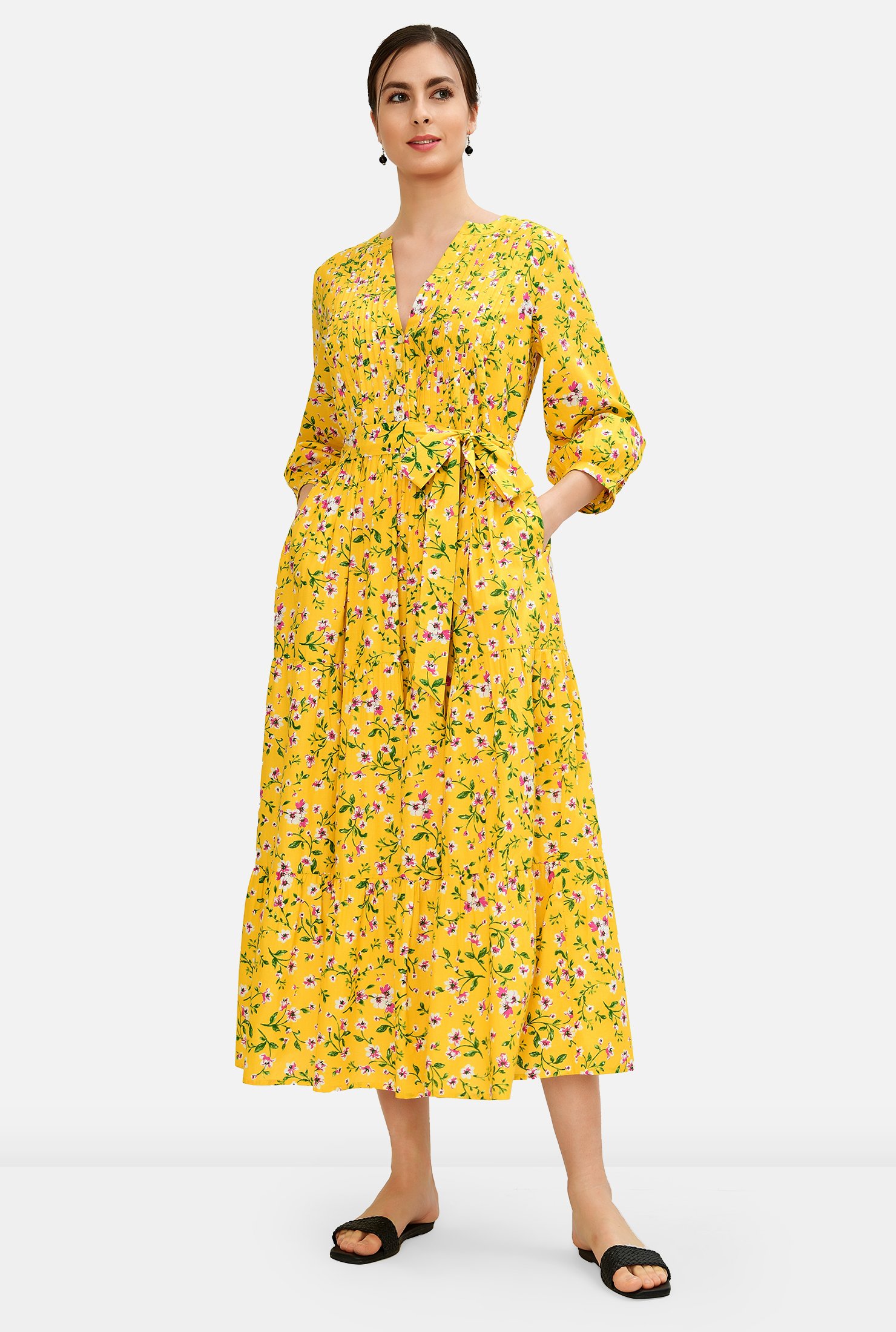 Our light and lovely cotton cambric dress with a sun-drenched floral print and an airy silhouette features a pintuck-pleat front bodice, swingy ruched tier full skirt and an optional self-sash-tie belt.