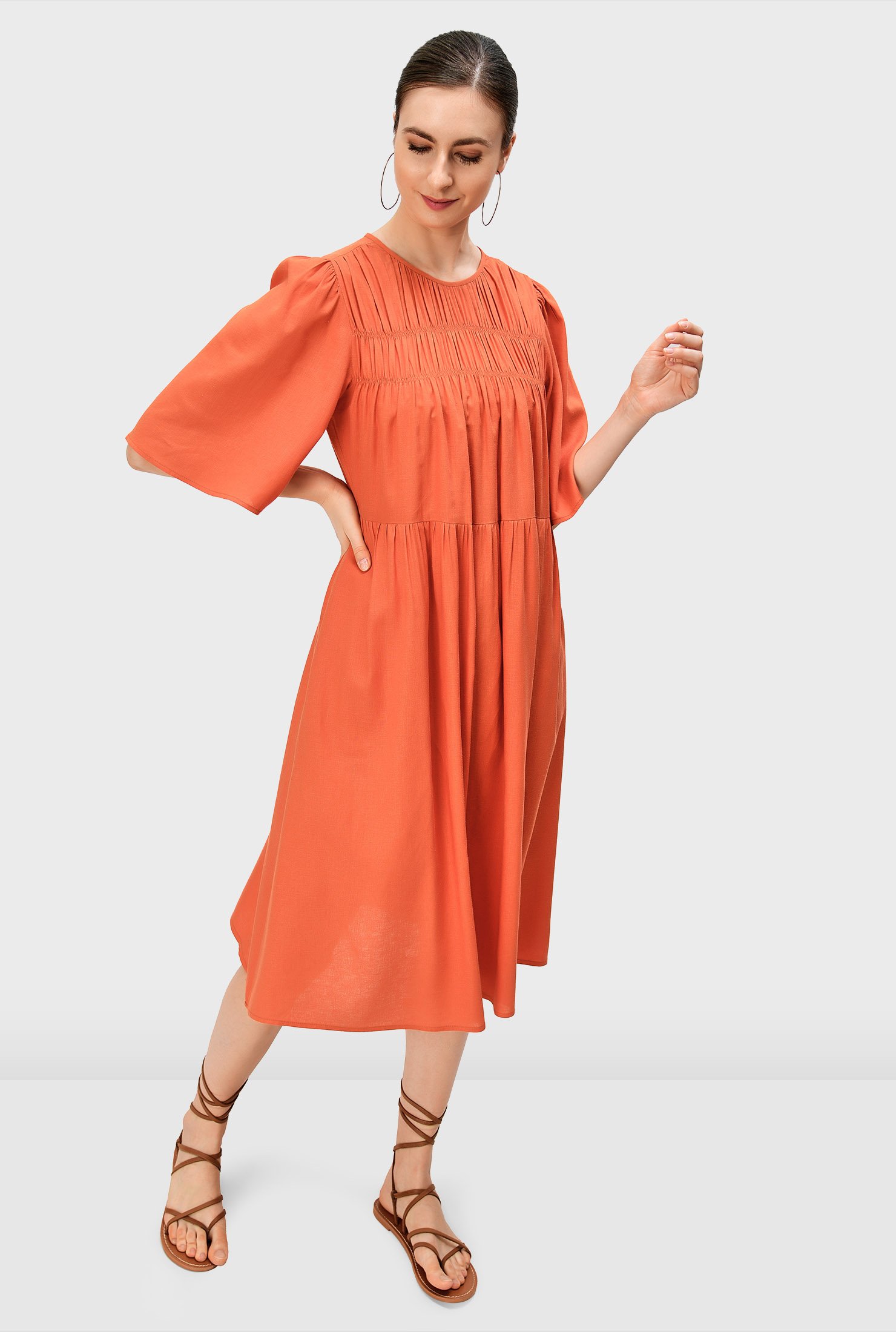 Summertime, and the linen's easy! Our flared swing style linen modal shift dress is shirred at the elasticated front yoke and at the full skirt, a definition of effortless style.