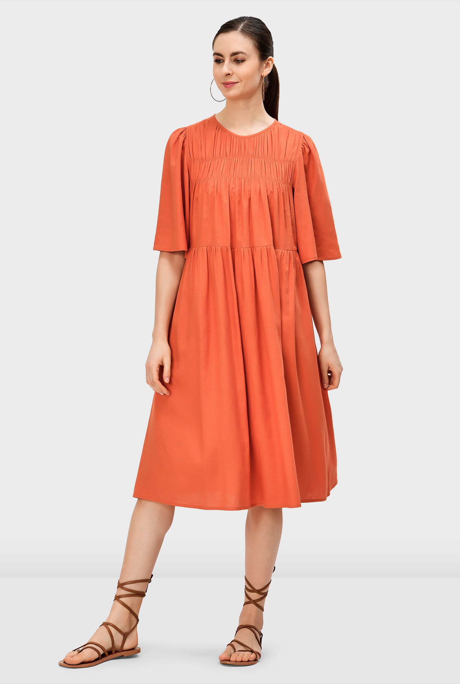 Summertime, and the linen's easy! Our flared swing style linen modal shift dress is shirred at the elasticated front yoke and at the full skirt, a definition of effortless style.