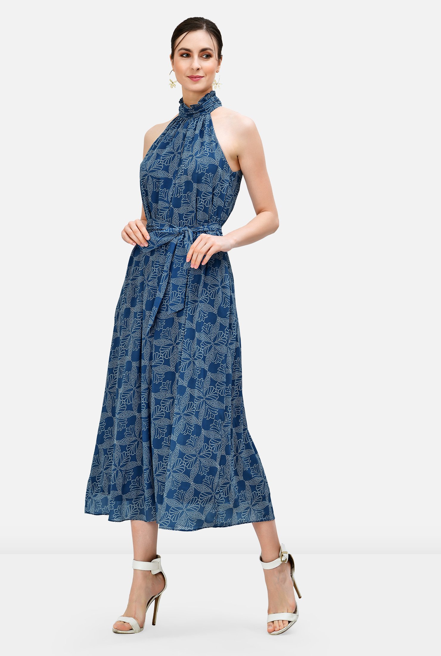 Light, sheer floral dot print makes a charming first impression, and then the details of our breezy georgette dress emerge from the ruffle frill trimmed halter neck that releases to a full flare hem and is cinched in with an optional self-sash-tie belt.