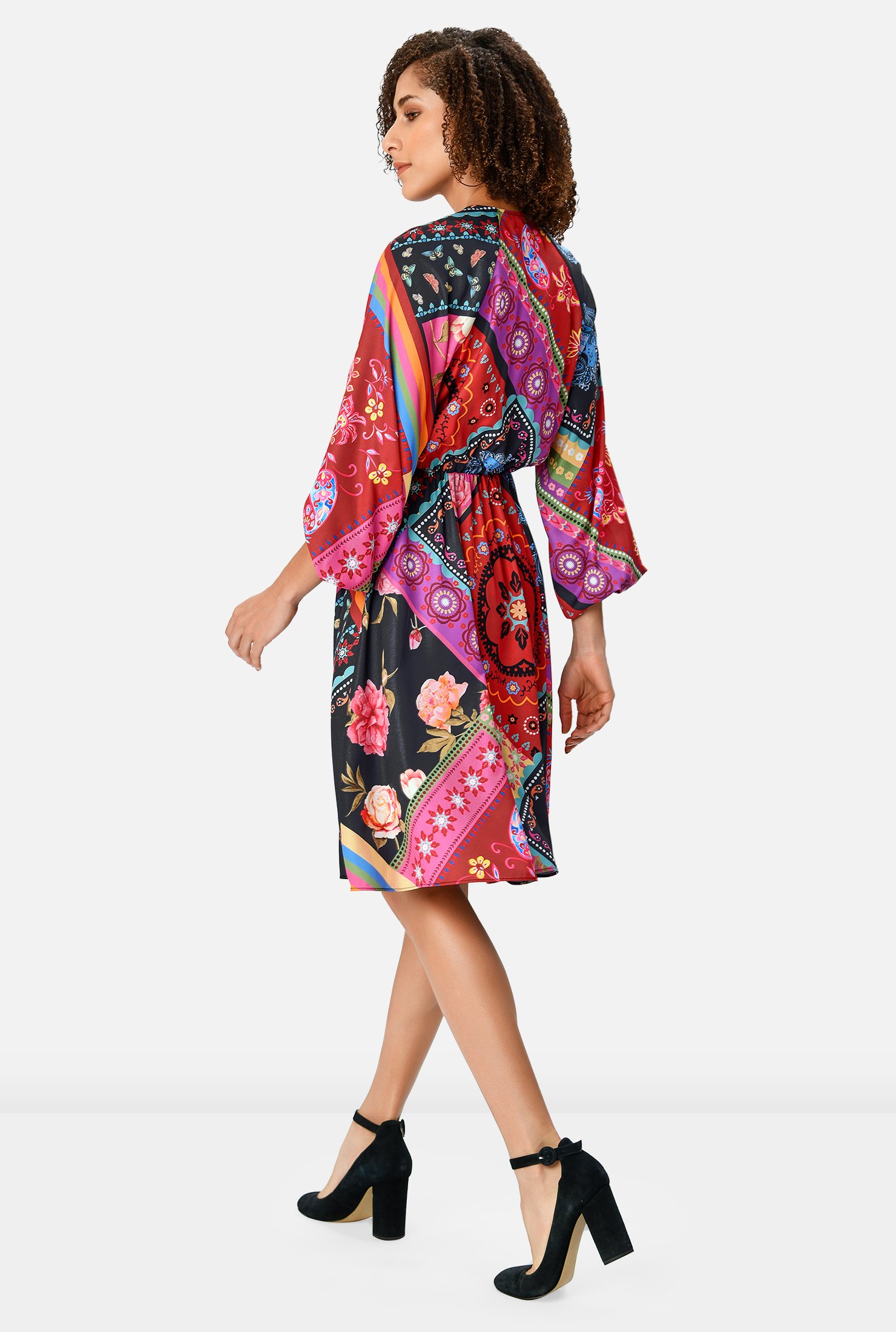 Bold brilliance! A blouson surplice bodice and ruched pleat full skirt enhance the playful drape of our robe-style crepe dress in a colorful scarf print cinched in at the elastic waist.