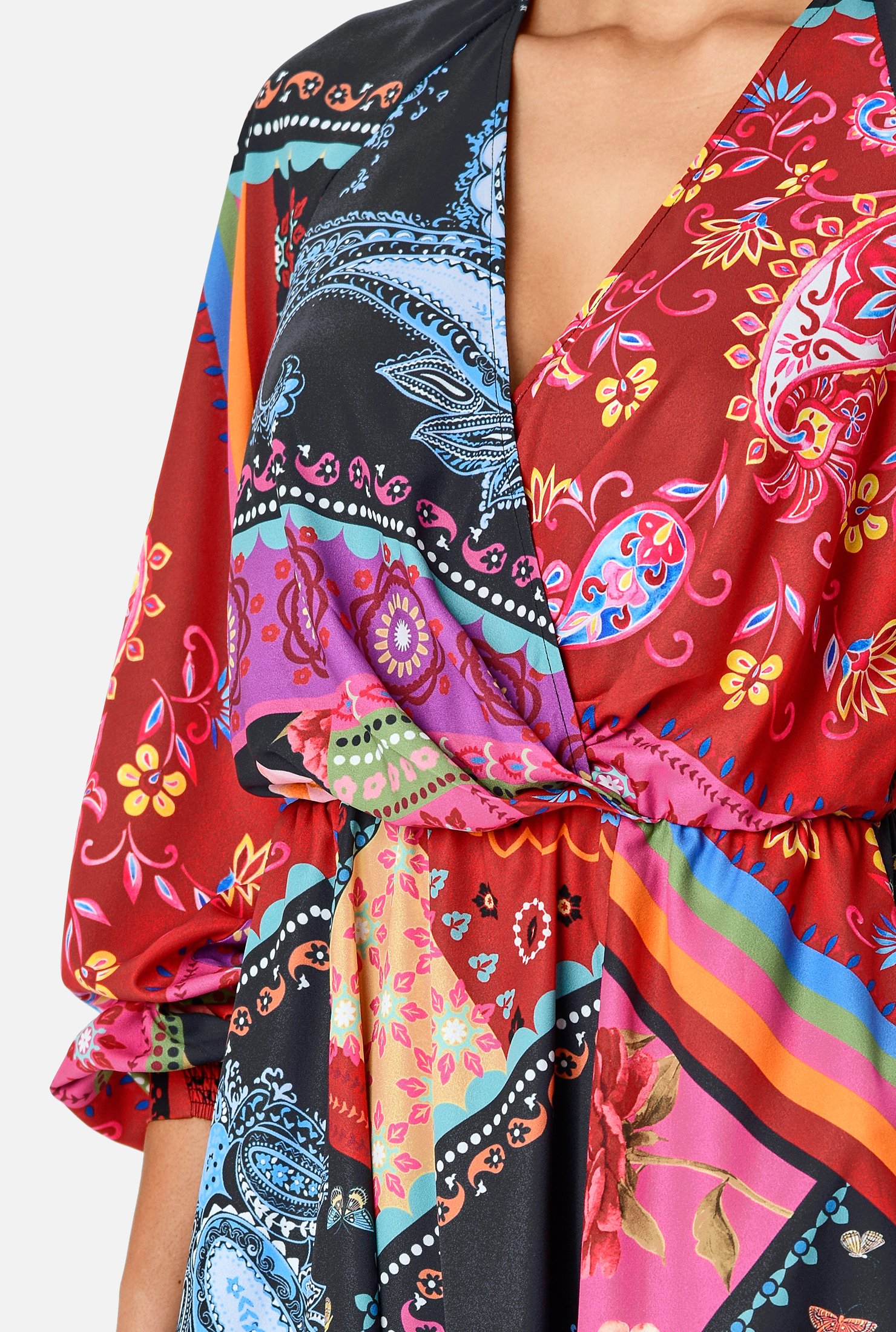 Bold brilliance! A blouson surplice bodice and ruched pleat full skirt enhance the playful drape of our robe-style crepe dress in a colorful scarf print cinched in at the elastic waist.