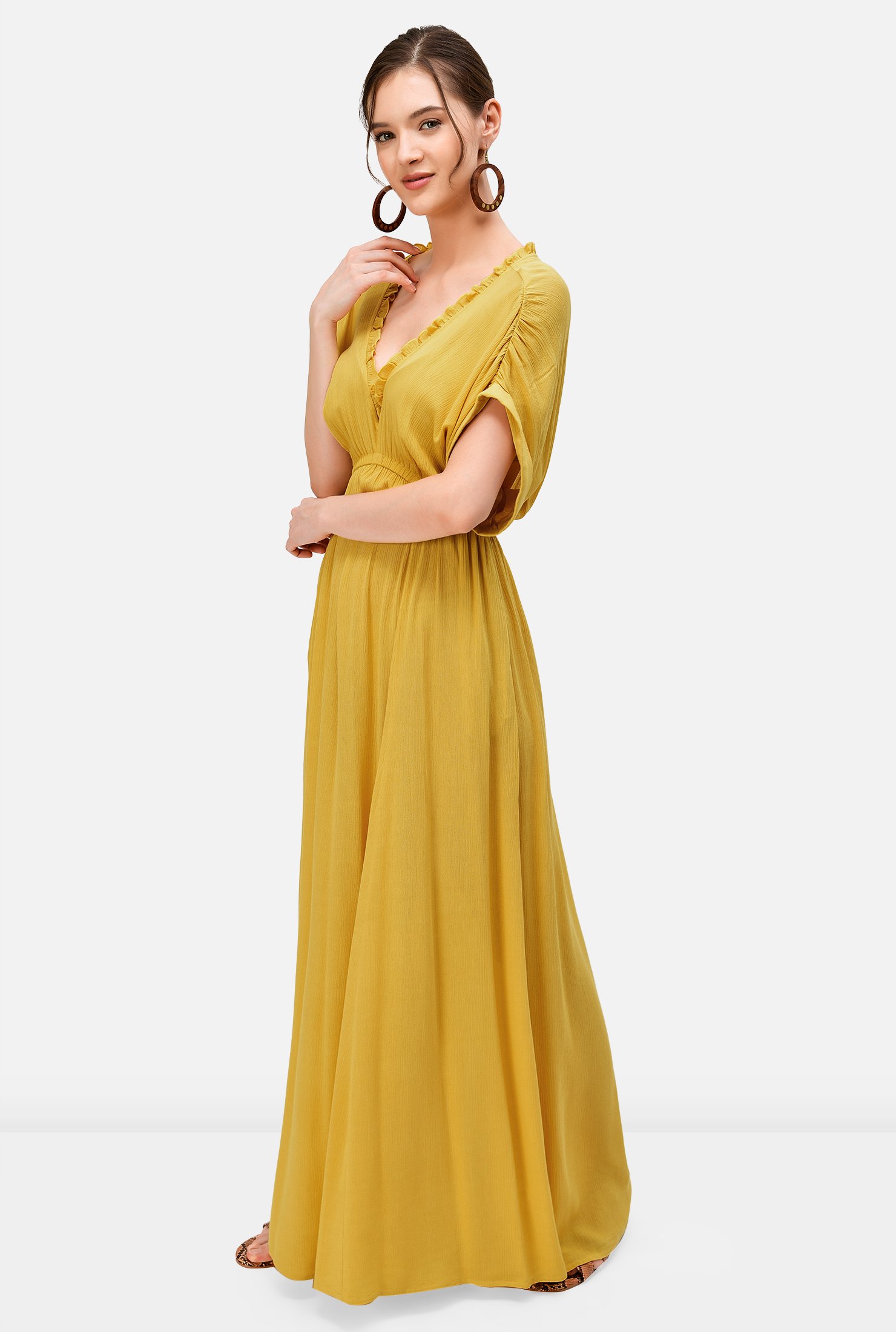 Look forward to warm weather and sunshine in our light crinkle maxi dress trimmed with ruffle frills at the neckline and elasticated at the shoulders and empire waist for soft texture.  