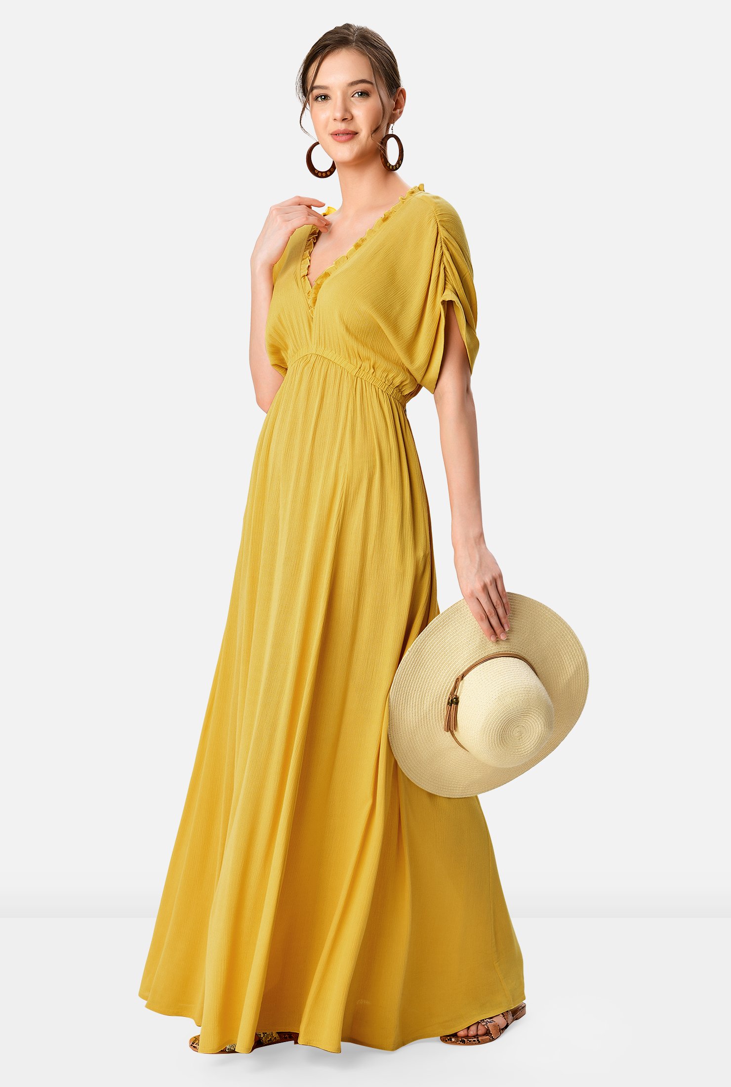 Look forward to warm weather and sunshine in our light crinkle maxi dress trimmed with ruffle frills at the neckline and elasticated at the shoulders and empire waist for soft texture.  