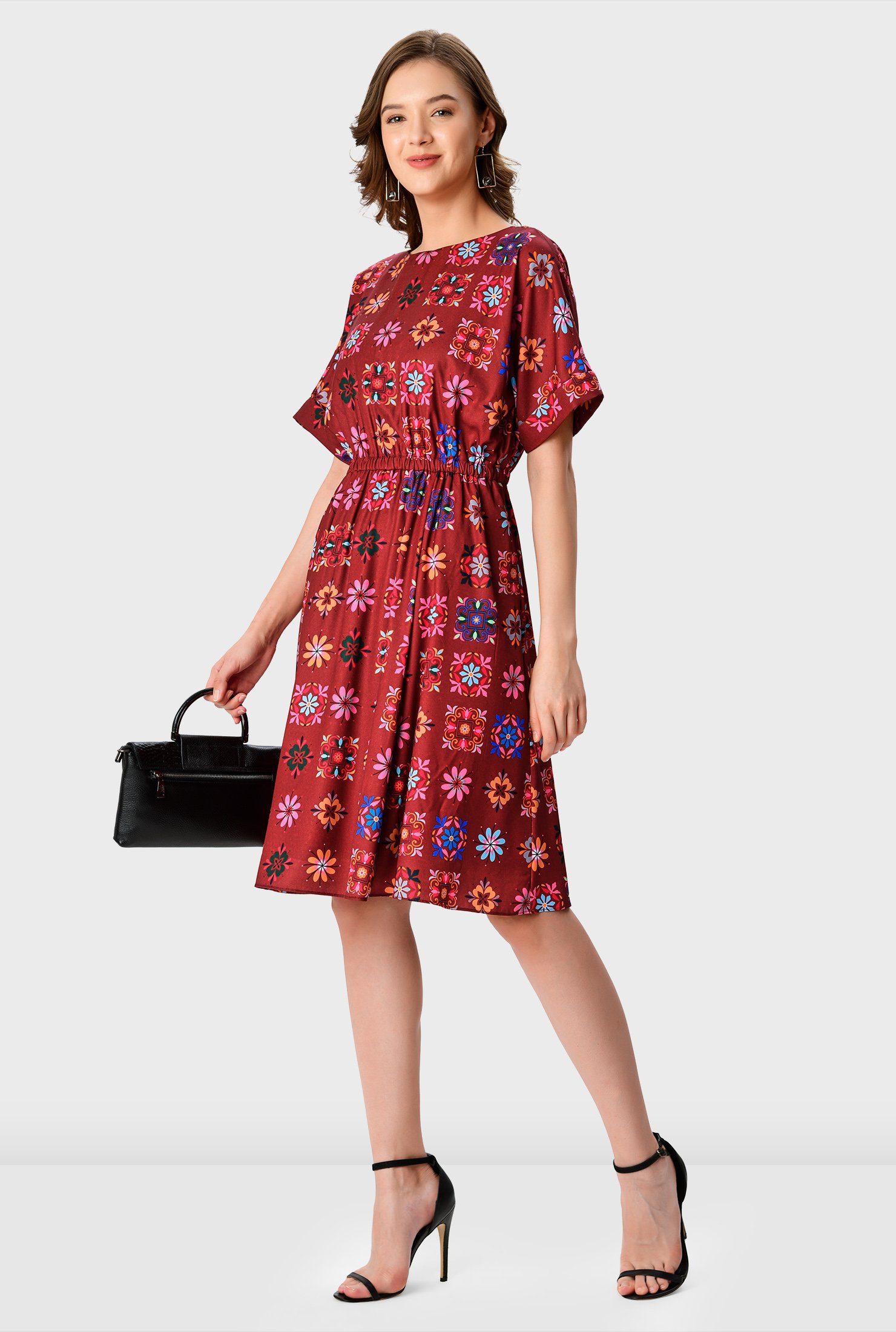 Let the colors pop! Our versatile dress to see you through the season in colorful floral print crepe is styled with easy dolman sleeves and cinched in with an elastic waist for a blousony fit.