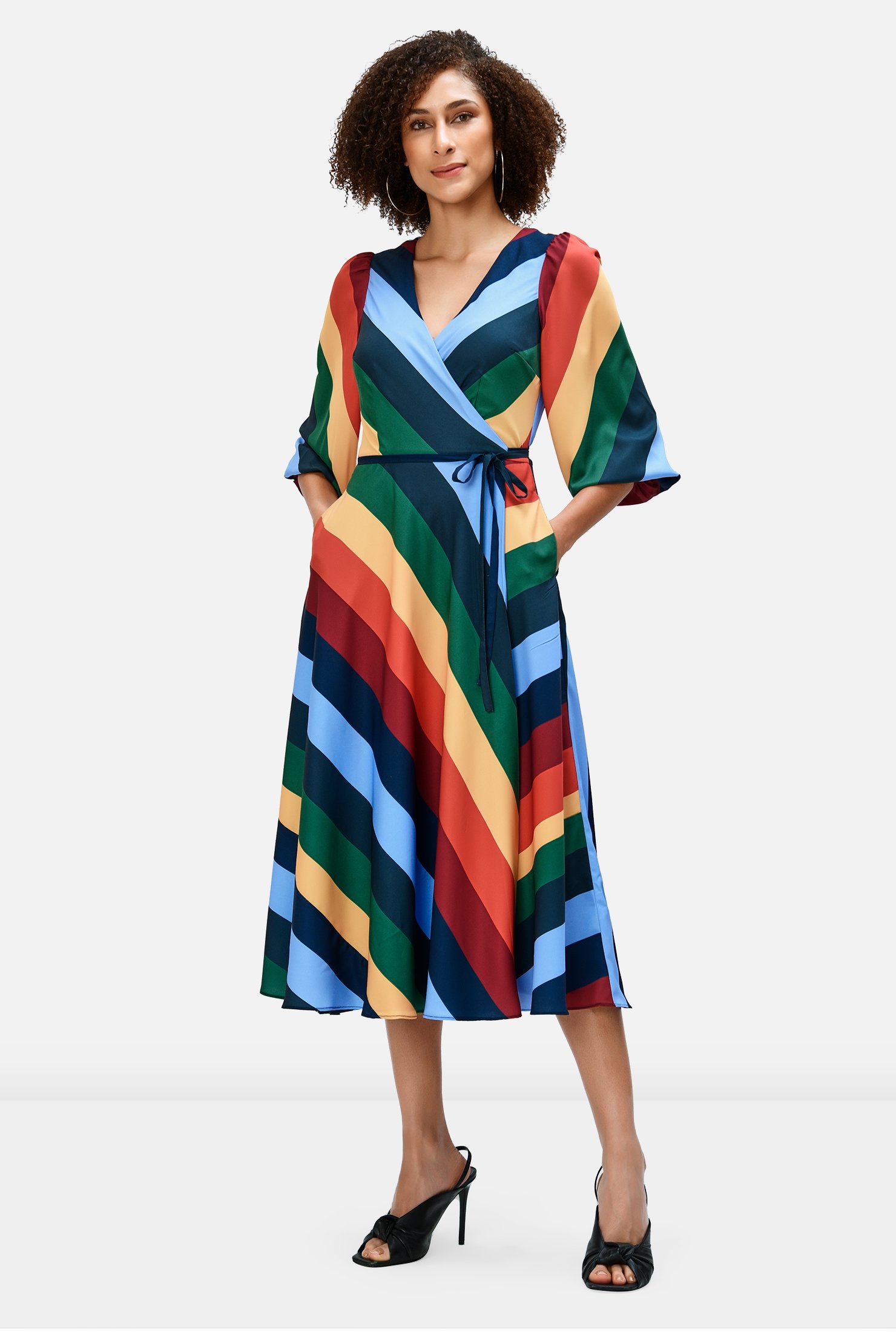 Rainbow bright stripes pattern our bias-cut crepe wrap dress cinched in at the seamed waist with attached half-ties.