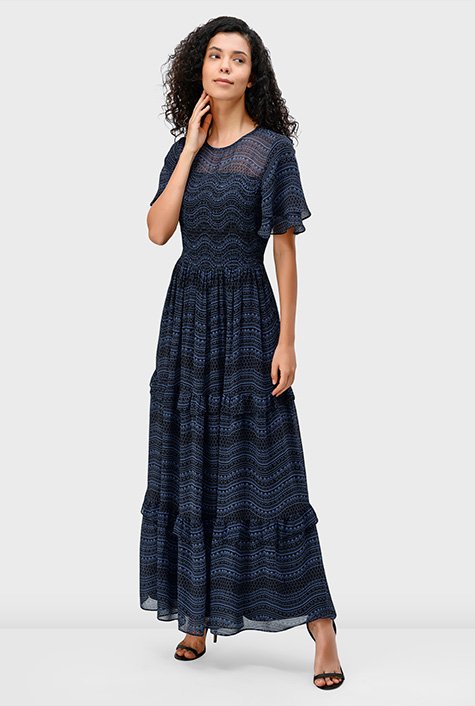 Tiered ruffles and gathered seams float gracefully on our airy elastic-smocked bodice dress that's ideal for work-to-dinner charm.