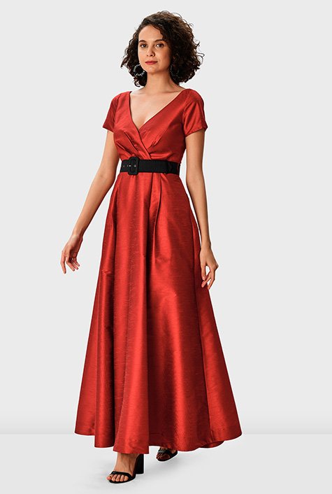 Timeless and universally flattering, our floor-length poly dupioni gown is tailored with a pleated surplice bodice, an elegantly draped skirt and contrast luxe belt. 