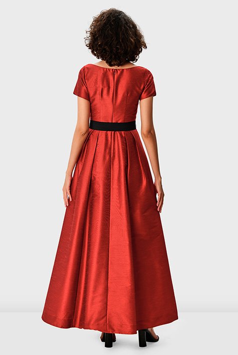Timeless and universally flattering, our floor-length poly dupioni gown is tailored with a pleated surplice bodice, an elegantly draped skirt and contrast luxe belt. 